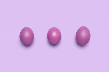 Dyed Easter eggs on lilac background
