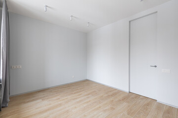 Empty gray room ready for people to move in