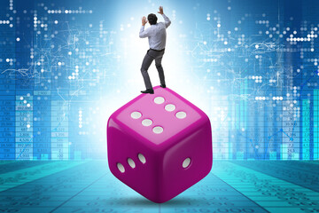 Businessman in uncertainty concept with dice
