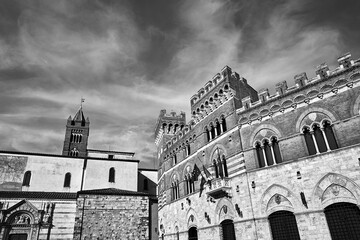 Belfry of historic cathedral and Towers of a renaissance castle in the city of Grosseto