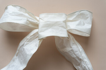 asymmetrical retro bow made of paper ribbon