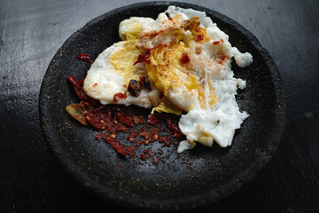 Omelet with red chili sauce