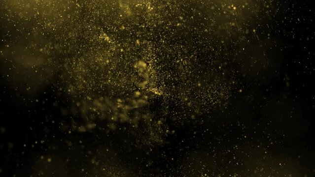 Gold dust particles fly in slow motion in the air lingering slowly. Dust Particles Background Bokeh Lights Background on Black Background 4k Footage Snow Particles Background.