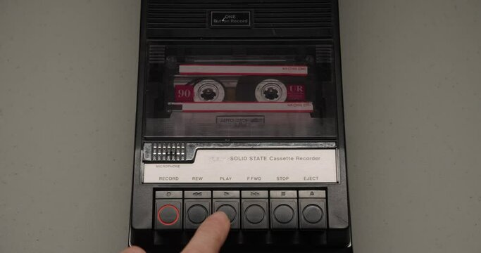 Close-Up Of Cassette Tape Playing In Recorder