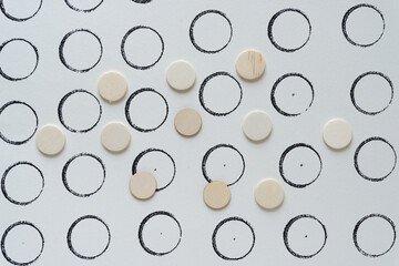 wooden dots on paper with ink stamp circles