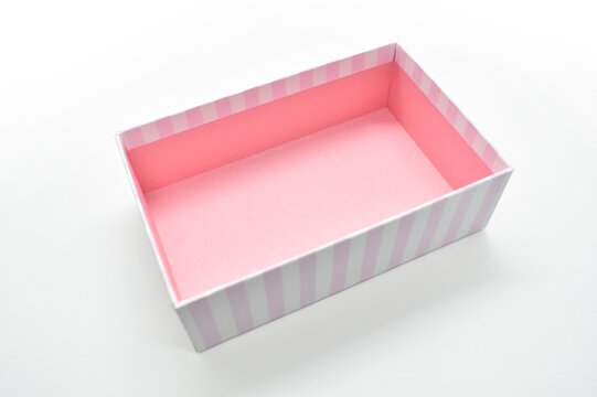 open beautiful pink box on white background, package for design