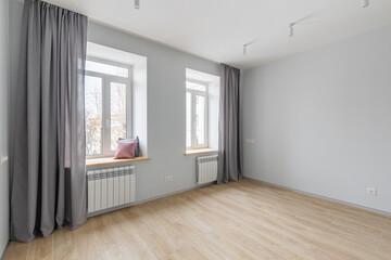 Empty gray room ready for people to move in