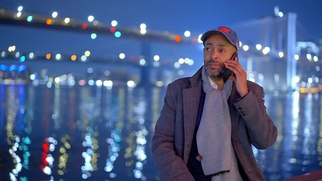 Afro-American Man Standing At Brooklyn Bridge New York At Night - Travel Photography