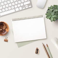 feminine desk / work space with office tools, succulent plant,  and a blank open notebook / ring binder for your message on a bright cream colored background, square format, ideal for social media 