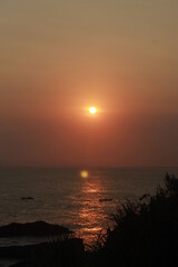 Fototapeta na wymiar Rockmantic sunset at Menganti Beach