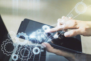 Creative abstract robotics technology sketch and hand working with a digital tablet on background, future technology and AI concept. Double exposure