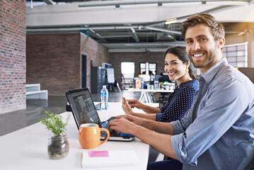 Teamwork, office and portrait of man and woman at desk with laptop at creative agency, working on...