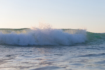 Clean wave shore break view in the morning.