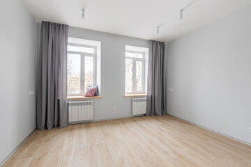 Empty gray room ready for people to move in