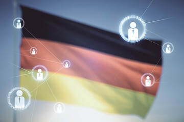 Double exposure of abstract virtual social network icons on German flag and blue sky background. Marketing and promotion concept