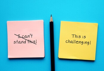 On blue background, pencil writing on paper I CAN'T STAND THIS, crossed off and changed to THIS IS...