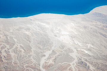 Fototapeta premium Beautiful earth and sea from a window airplane background