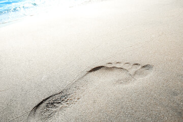 Fototapeta na wymiar Beautiful footprints on the beach in nature by the sea
