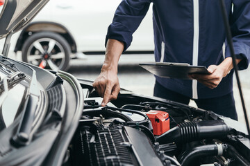 Automobile mechanic repairman hands repairing a car engine automotive workshop with a wrench, car service and maintenance,Repair service.