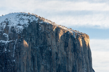 close-up of el capitan, catching the first rays of the rising sun on an early morning winter afternoon.