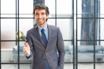 Businessman with an open hand ready to seal a deal.