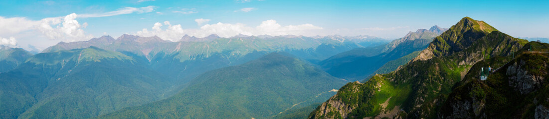 panorama: View of the Caucasus mountains at sunset in summer. Staircase in the mountains.