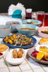 a dining table with different food served in a cafe or restaurant