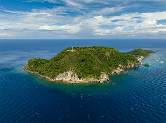 Apo Island popular dive site and snorkeling destination with tourists. Negros, Philippines.