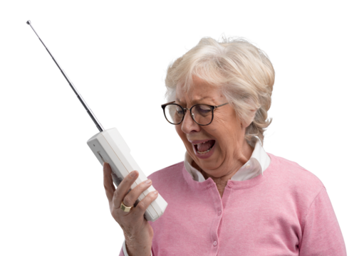 Frustrated senior woman using an old telephone