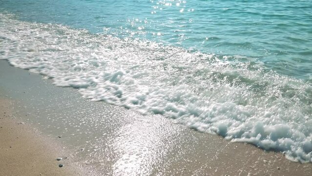 Beautiful sea waves on a sand beach. 4k slow motion footage UHD 3840x2160 