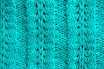 Abstract texture of a knitted bright surface with a pattern.