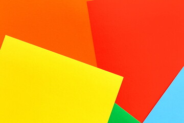 Bright abstract background from multi-colored paper cardboard.	