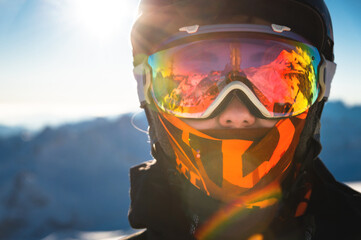 Portrait of a healthy woman in a sports mask looking directly at the camera against the backdrop of...