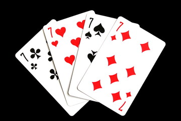 Playing cards lie on a black isolated background.