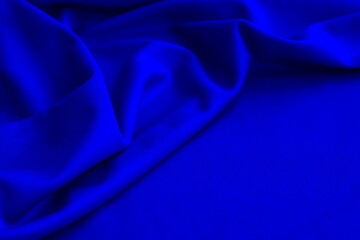 Bright thin knitted fabric with drapery with space for text.	