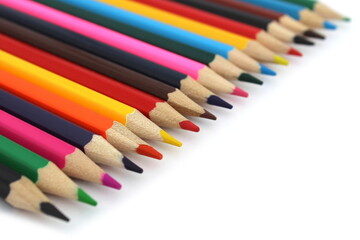 Bright colored pencils lie on a white background with space for text.