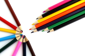  Bright multi-colored pencils lie on a white isolated background.