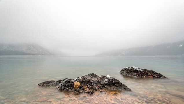 Storm clouds over mtn and lake