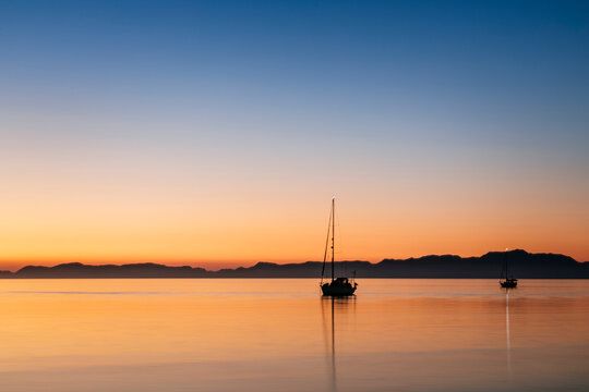 Anchored sailboats at sea at dawn, Loreto, Baja California Sur, Mexico