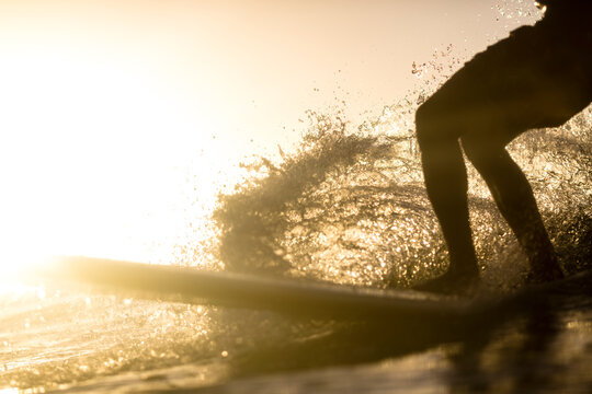 Man surfing at sunset