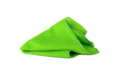 A green rag for cleaning lies on a white isolated background.
