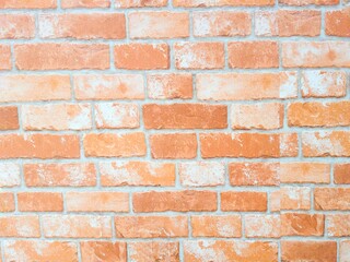 red brick wall with white cement surface.