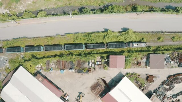 Electric locomotive with freight cars or railway wagon rides on railroad in Zonguldak.