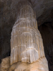 stalactites, stalagmites and large calcareous pillars inside the cave formed over millions of years