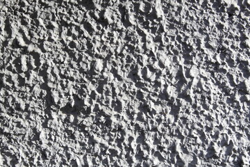 Abstract texture of corrugated concrete wall in gray color