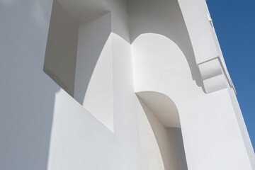 white painted walls with shadows on a sunny day. Traditional Greek or religion Abstract Architecture concept.
