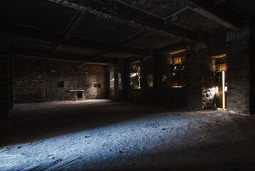 Empty abandoned creepy desertedroom with bright sun lights entering the windows