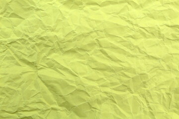  Soft crumpled sheet of light-colored paper. Abstract texture.