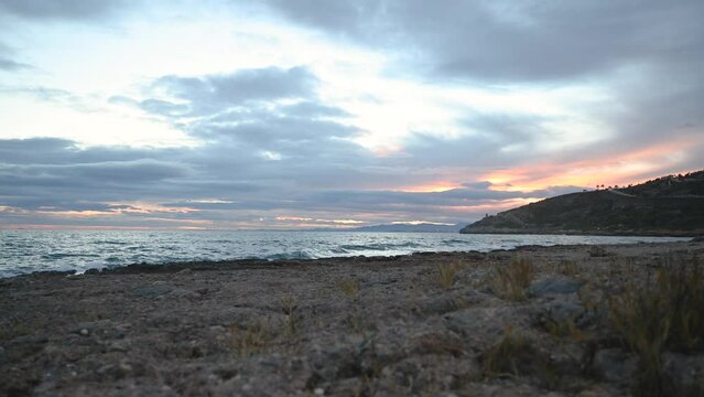 4K Fall sunset time-lapse with moving clouds over the Mediterranean Sea.
