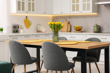 Spring atmosphere. Stylish kitchen interior with comfortable furniture